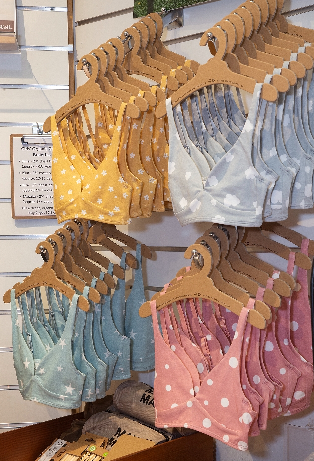 bras hanging up in a store