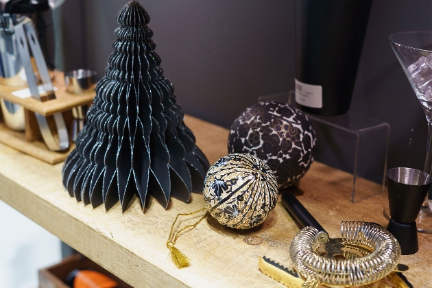 black christmas decorations on a shelf